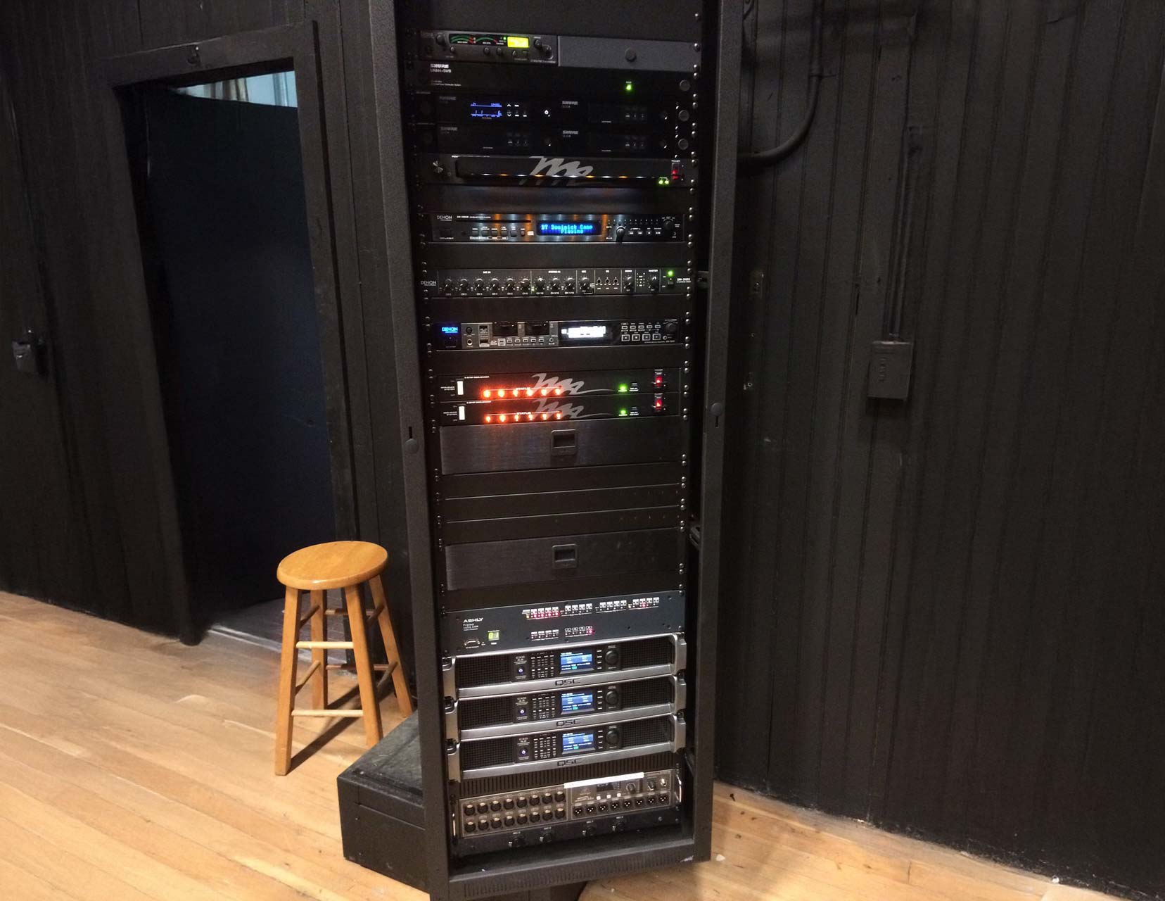 Installed audio equipment rack featuring amplifiers, processors, and signal distribution gear, serviced and supported by Pro Sound Associates in a professional venue.